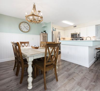 ??? "A Space for Meals and Memories. Whether you're sharing a family dinner, hosting a game night, or tackling a puzzle on a rainy day, this charming distressed wood table with seating for six