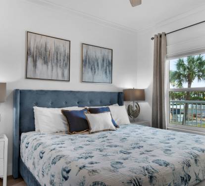 Primary bedroom with balcony access