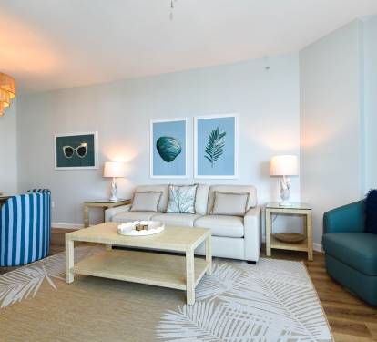 Airy living space w/ soft tones, coastal art, and a welcoming setup for relaxing stays.