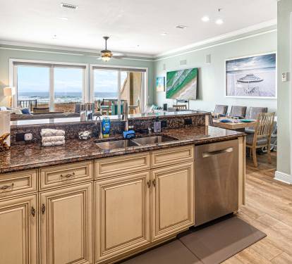 Entryway, and kitchen overlooking the living room and great view of the Gulf!