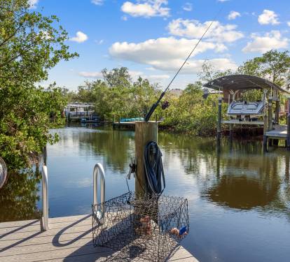 Private Dock: Your private waterfront access. Perfect for boating, fishing, or enjoying the peaceful canal views.