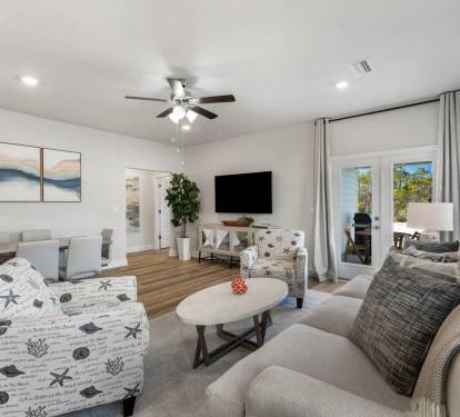 An open living space designed for connection, flowing seamlessly into the dining area.