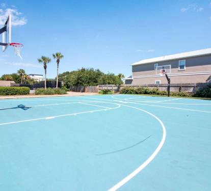 Outdoor basketball court on-site, perfect for a quick game or shooting hoops under the sun.