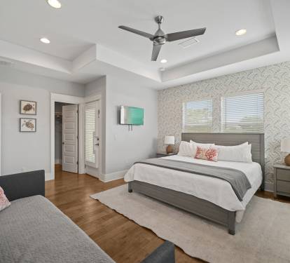 Elegant Grand Master King Suite with ensuite bath, twin daybed, and large walk-in closet.