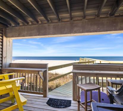 downstairs patio with new boardwalk to the beach