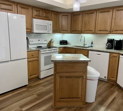 Updated kitchen has new refrigerator with ice maker and all kitchen necessities