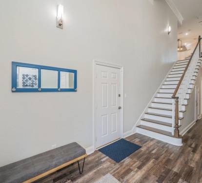 First-floor entrance & stairway w/ simple, clean design