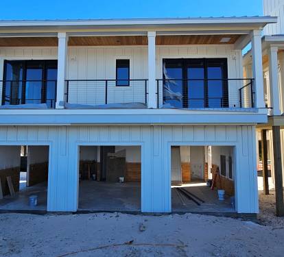 Carriage Exterior. In the garage there will be a bar, pool table, tv, & darts. To the left of the carriage is a firepit patio & Grill. Carriage can be rented separately for smaller groups.