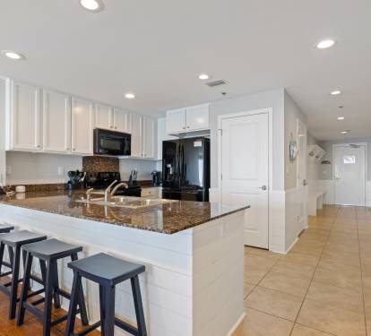 The saddle stools at the breakfast bar provide additional seating and a great place to sit and talk with the cook.
