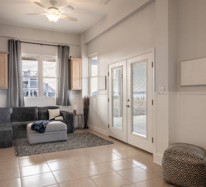 Playroom/Bonus Space with sleeper sofas and 65 inch Roku TV. Direct access to dock and Lagoon views.