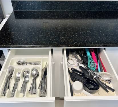 Fully stocked with pots, pans, dishes, silverware and glasses!