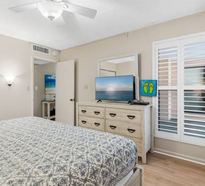 Coastal furnishings and natural light create a bright and relaxing retreat.