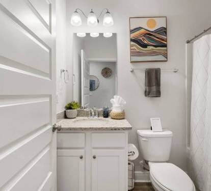 Bathroom 1: Charming cozy bathroom with warm, inviting details.