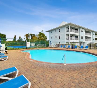 The swimming pool with lounge chair