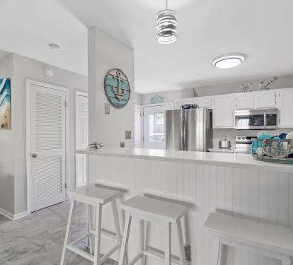 Dining into kitchen area. Seating for 8