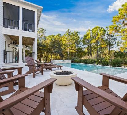 Relax around the poolside fire pit in comfortable Adirondack chairs, just steps from the private pool and spa—your go-to spot for unwinding, conversation, and memorable nights under the coastal sky.