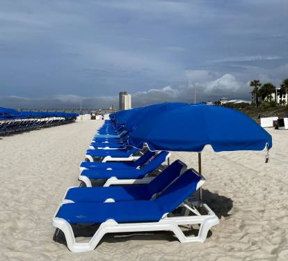 Just steps from the sugar-white sands—complimentary beach chairs await you!
