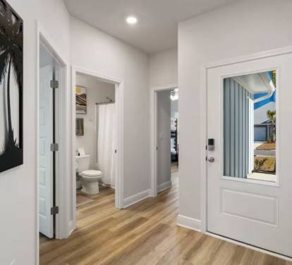 Entry way: Hallway going to the bathroom, bedroom and backyard