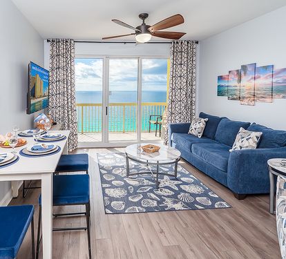 Living Room with Dining Table, 65" Smart TV, Queen Sofa Bed, and Reclining Chair