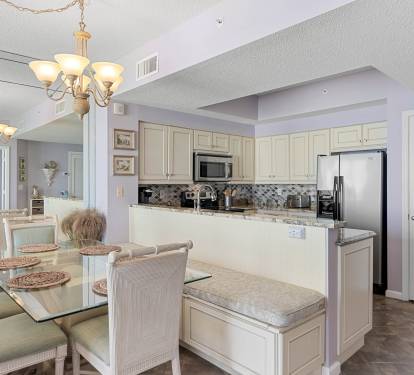 Kitchen bar seating offers a casual spot for coffee, snacks & conversation.