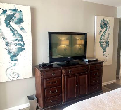 Master bedroom with large TV. 