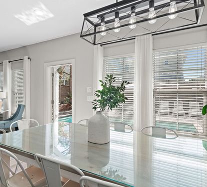 Custom glass dining table with seating for eight.