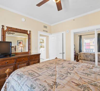 Queen bedroom with large closet and tv