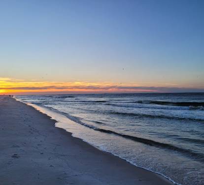 Enjoy the sunrise while listening to the sound of the waves while walking on the white sands of bama