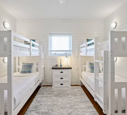 An awesome bunk room down with individual lights and charging at each bunk.
