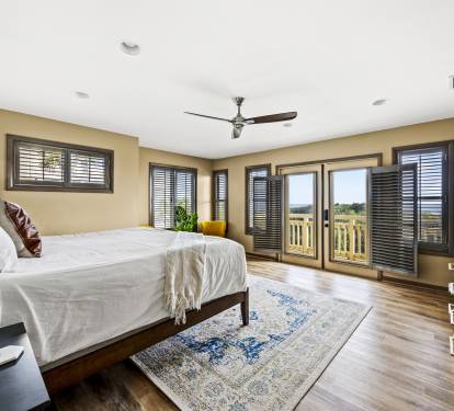 Experience spaciousness and personal space in the lower floor Master bedroom suite, equipped with all the modern comforts, TV, A/C and ceiling fan.