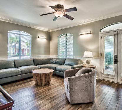 Open-concept living area with vaulted ceilings and abundant natural light