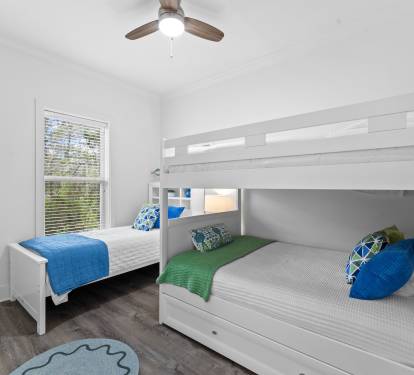 The sun-filled bunk room looks out to Sunnyside' s yard and has a TV for movies.