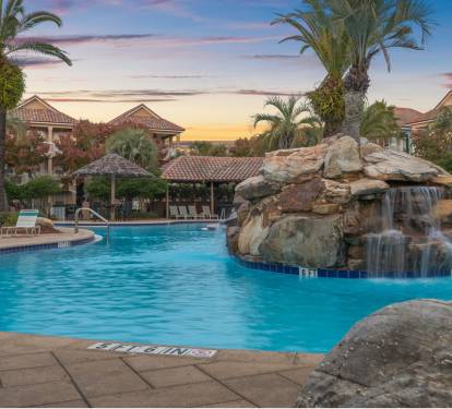 Happy hour at the pool. Sunset, a waterfall, drinks in hand. This is the life.