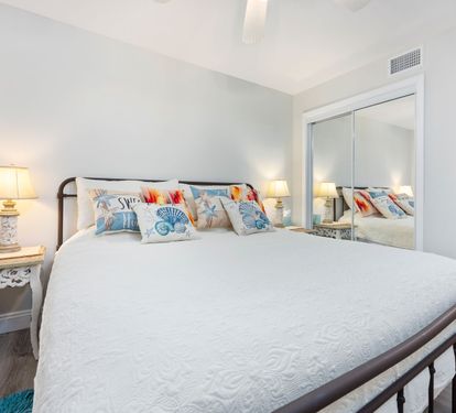 ??? "A Cozy Coastal Retreat. The guest bedroom offers a spacious king bed, stylish furnishings, and all the comforts of home—including a TV, dresser, nightstands, and a roomy closet." ???