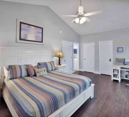 Master Bedroom #1-High Ceilings with gulf view and slider leading to wrap around deck with twin bed swing.