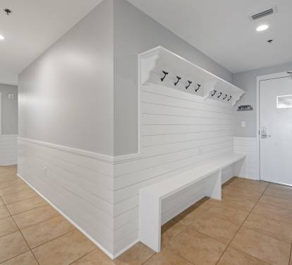 An organizer's dream come true!  This 10+ foot long hallway built-in provides plenty of storage to hang your beach bags, put up your keys on the custom "Panama City" key holder and store your flip flops.