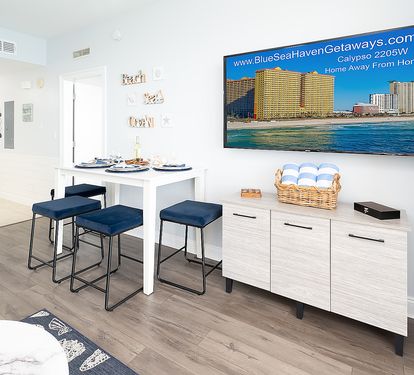 Dining table, chairs, smart 65" TV