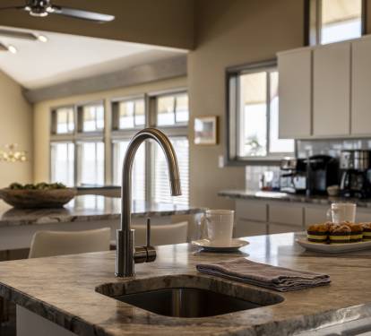 The spacious layout and high-end amenities make it the perfect space for hosting and enjoying meals with stunning ocean views.