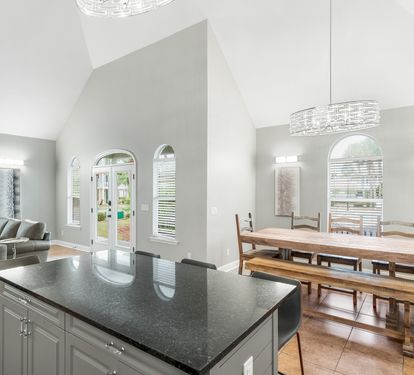 Kitchen and dining area with open sightlines to the living room