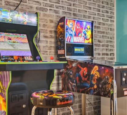 The Game Room is located on the second level  and includes Teenage Mutant Ninja Turtles arcade game, Marvel pinball machine, air hockey/ping pong table, mini fridge, and game stick with countless retro games,  with access to the front balcony.