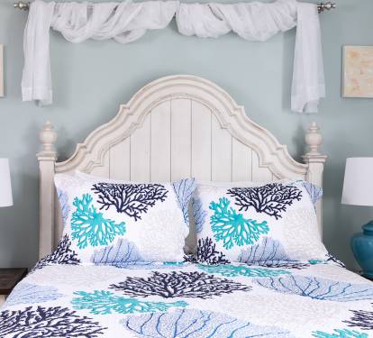 Settle into a comfortable queen bed dressed in hotel-quality linens and soft pillows at the end of the day. The room offers generous storage for clothing and personal items, with a closet, shelving, and bedside storage that make it easy to unpack, stay or
