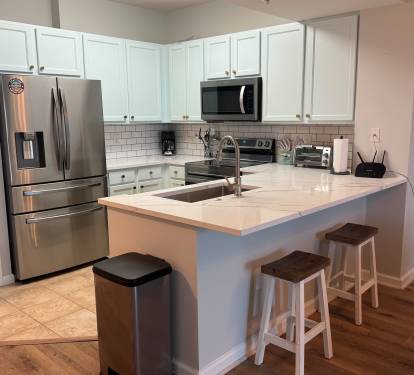 This well equipped kitchen also offers additional seating for two people.