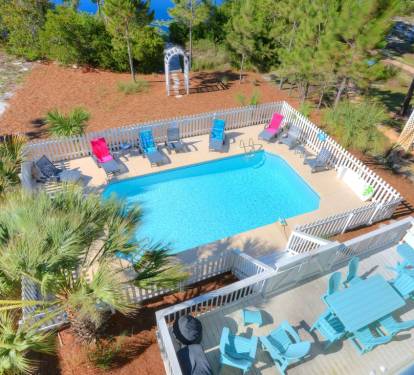 Private Pool overlooking lake. Plenty of seating. Grill for poolside dining.
