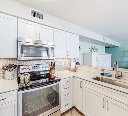 ?? "A Chef’s Dream. This updated kitchen features sleek granite countertops, a stunning tile backsplash, and stainless steel appliances—including a stove, refrigerator, dishwasher, and microwave—perfect for whipping up your favorite meals at After Dune De