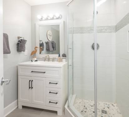 Updated coastal hall bath with walk in shower