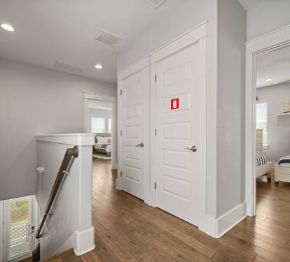 Upstairs hallway providing easy access to bedrooms and living spaces.