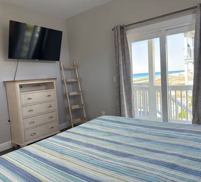 King Bedroom on Main level-Gulf Views. Great views of gulf and access to deck.