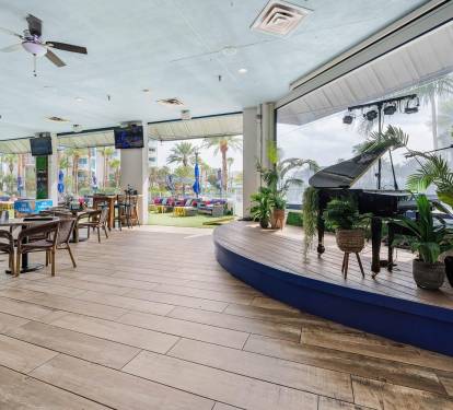 Entertainment space near the pool w/ room to gather and enjoy shared moments.