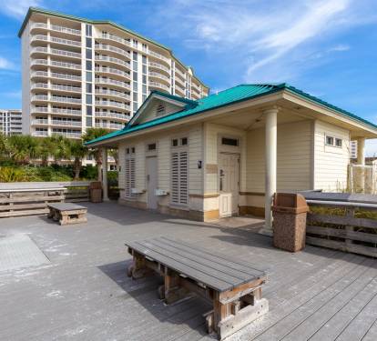 Beach access pavilion w/ benches & nearby facilities for easy days by the shore