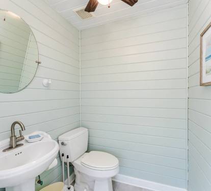 A Convenient and Charming Bathroom Located in the Pool House